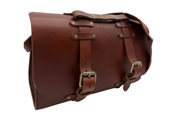 A dark brown leather satchel with double buckle straps and sliver-tone brass-toned hardware, shown against a plain white background.